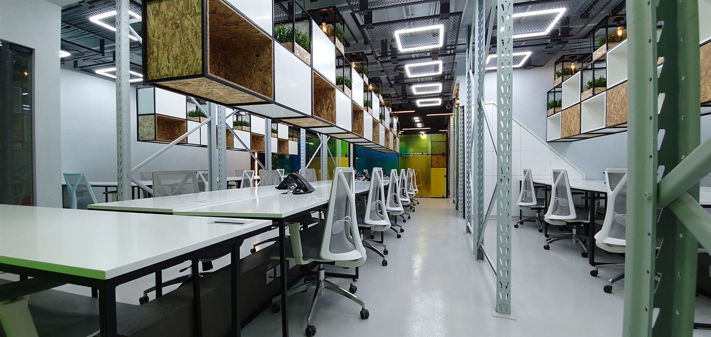 Head office workspace with steel frames and timber meeting boxes overhead